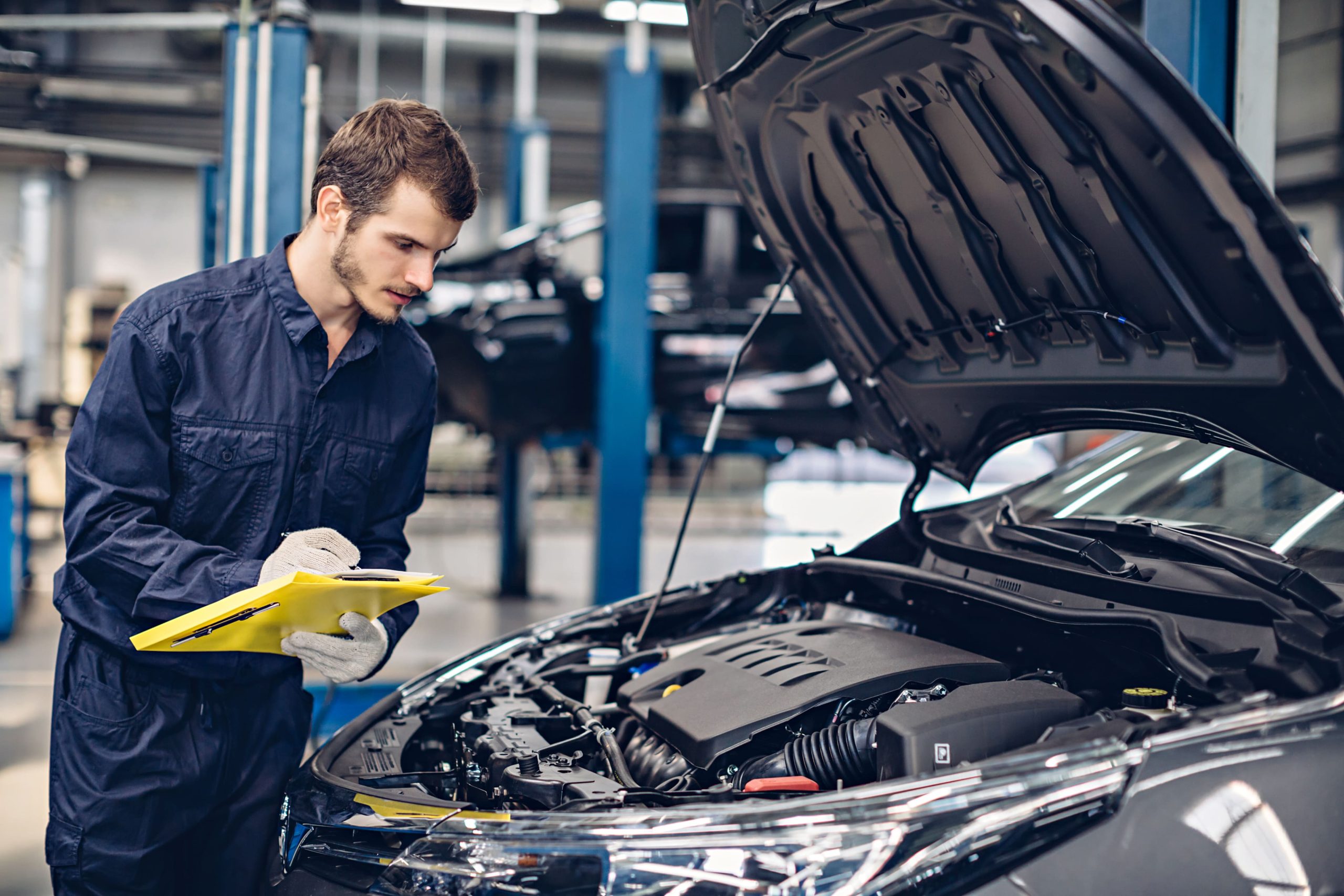Mechanic inspecting a car's engine