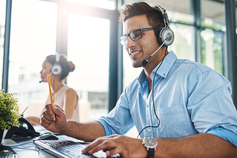 Customer service representative with headset on call